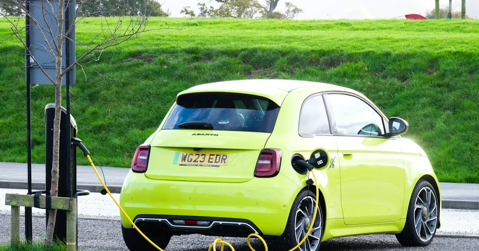 A sleek, futuristic image of the Tesla Cybercab on a US highway