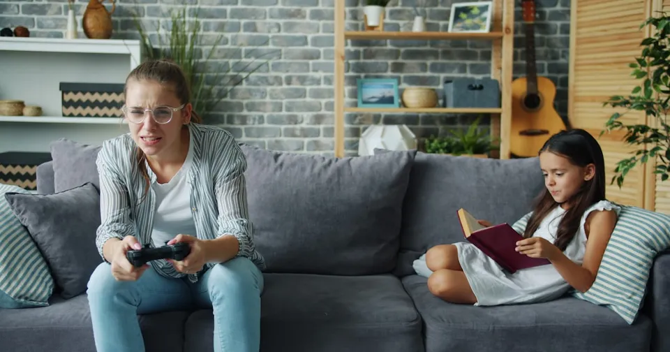 A child playing a game on a tablet with a Netflix logo on the screen