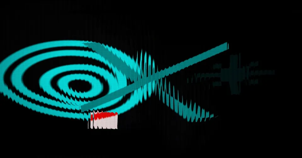 A group of young artists working together on a digital design project with laptops and tablets