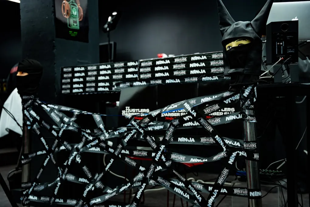A detailed illustration of a cybersecurity expert monitoring a network for potential threats, with multiple screens displaying code and system vulnerabilities.